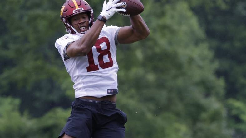 May 24, 2022; Asburn, VA, USA; Washington Commanders wide receiver Antonio Gandy-Golden (18) catches a pass during drills as part of OTAs at The Park in Ashburn. Mandatory Credit: Geoff Burke-USA TODAY Sports