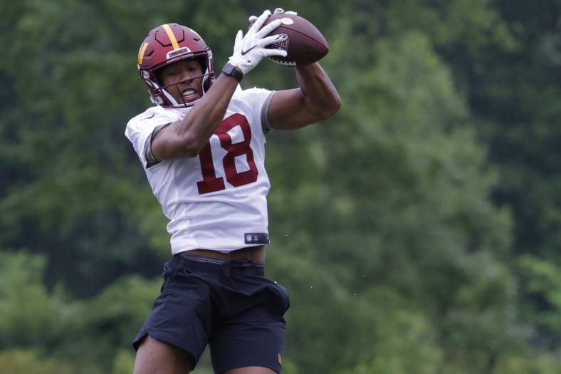 May 24, 2022; Asburn, VA, USA; Washington Commanders wide receiver Antonio Gandy-Golden (18) catches a pass during drills as part of OTAs at The Park in Ashburn. Mandatory Credit: Geoff Burke-USA TODAY Sports