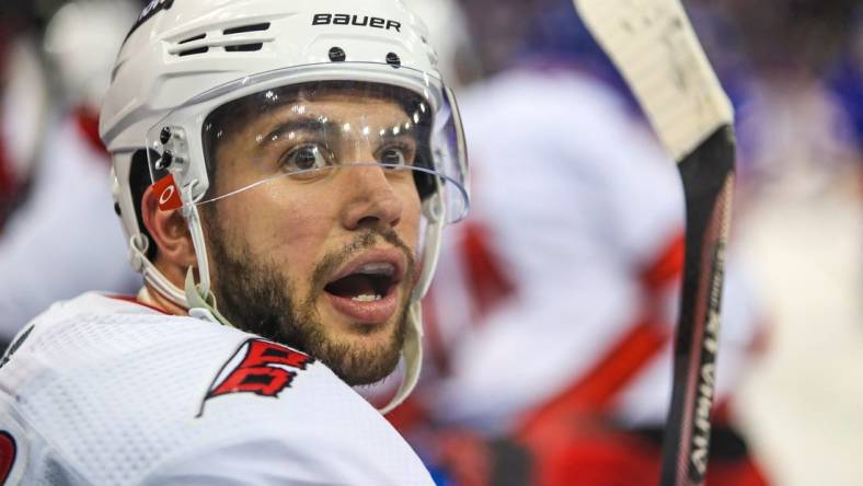 May 24, 2022; New York, New York, USA; Carolina Hurricanes defenseman Tony DeAngelo (77) catches this breath on the bench during a timeout against the New York Rangers during the third period in game four of the second round of the 2022 Stanley Cup Playoffs at Madison Square Garden. Mandatory Credit: Danny Wild-USA TODAY Sports