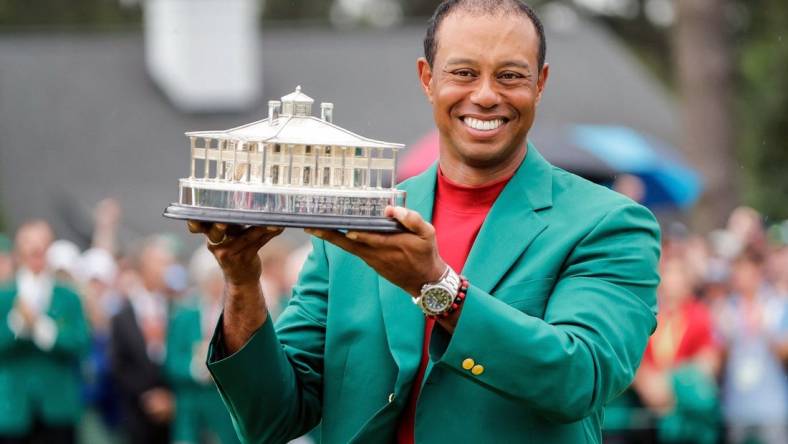 Tiger Woods celebrates during the trophy presentation after winning the Masters Tournament at Augusta National Golf Club, Sunday, April 14, 2019, in Augusta, Georgia. [ALLEN EYESTONE/FOR THE AUGUSTA CHRONICLE]