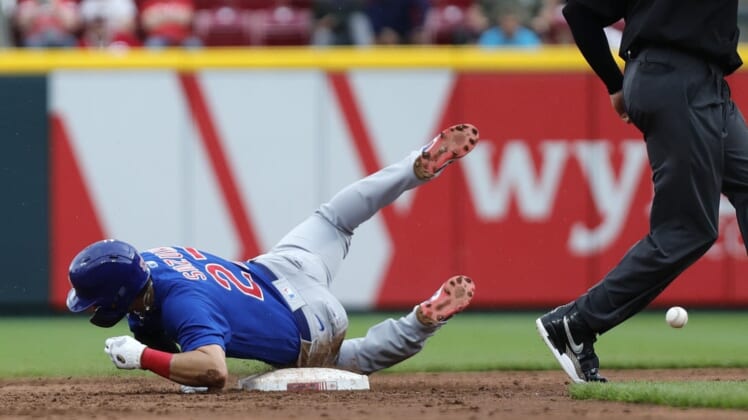 May 26, 2022; Cincinnati, Ohio, USA; Chicago Cubs right fielder Seiya Suzuki (27) slides safely after stealing second base against the Cincinnati Reds during the third inning at Great American Ball Park. Mandatory Credit: David Kohl-USA TODAY Sports