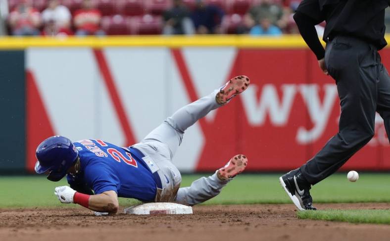 May 26, 2022; Cincinnati, Ohio, USA; Chicago Cubs right fielder Seiya Suzuki (27) slides safely after stealing second base against the Cincinnati Reds during the third inning at Great American Ball Park. Mandatory Credit: David Kohl-USA TODAY Sports