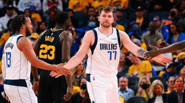 May 26, 2022; San Francisco, California, USA; Dallas Mavericks guard Luka Doncic (77) high fives guard Jalen Brunson (13) after a play against the Golden State Warriors during the second half of game five of the 2022 western conference finals at Chase Center. Mandatory Credit: Kelley L Cox-USA TODAY Sports
