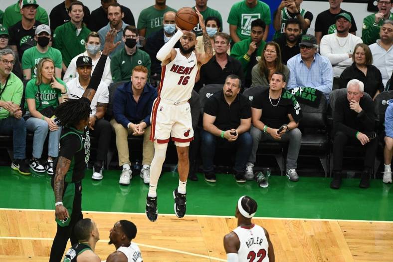 May 27, 2022; Boston, Massachusetts, USA; Miami Heat forward Caleb Martin (16) shoots against the Boston Celtics during the first half in game six of the 2022 eastern conference finals at TD Garden. Mandatory Credit: Brian Fluharty-USA TODAY Sports