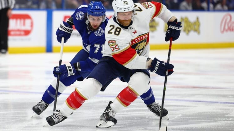 May 22, 2022; Tampa, Florida, USA; Florida Panthers right wing Claude Giroux (28) controls the puck from Tampa Bay Lightning center Anthony Cirelli (71) in the first period in game three of the second round of the 2022 Stanley Cup Playoffs at Amalie Arena. Mandatory Credit: Nathan Ray Seebeck-USA TODAY Sports