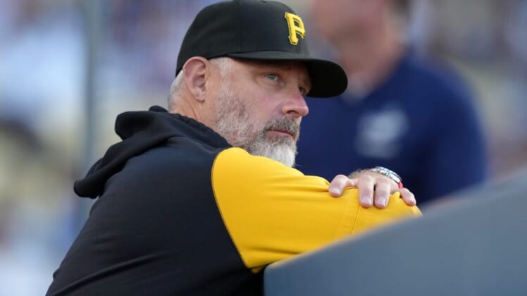 May 31, 2022; Los Angeles, California, USA; Pittsburgh Pirates manager Derek Shelton (17) watches from the dugout during the game against the Los Angeles Dodgers at Dodger Stadium. Mandatory Credit: Kirby Lee-USA TODAY Sports