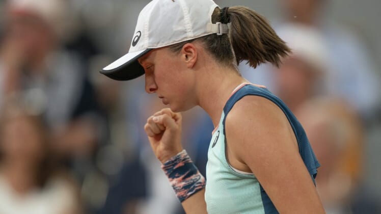June 4, 2022; Paris, France; Iga Swiatek (POL) reacts to a point during the women s singles final against Coco Gauff (USA) on day 14 of the French Open at Stade Roland-Garros. Mandatory Credit: Susan Mullane-USA TODAY Sports