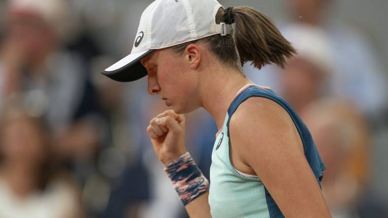 June 4, 2022; Paris, France; Iga Swiatek (POL) reacts to a point during the women s singles final against Coco Gauff (USA) on day 14 of the French Open at Stade Roland-Garros. Mandatory Credit: Susan Mullane-USA TODAY Sports