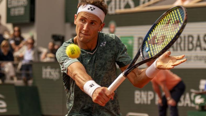 June 5, 2022; Paris, France; Casper Ruud (NOR) returns a shot during the men s singles final against Rafael Nadal (ESP) on day 15 of the French Open at Stade Roland-Garros. Mandatory Credit: Susan Mullane-USA TODAY Sports