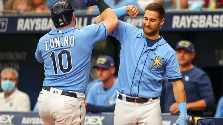 Jun 5, 2022; St. Petersburg, Florida, USA;  Tampa Bay Rays catcher Mike Zunino (10) is congratulated by center fielder Kevin Kiermaier (39) after hitting a two-run home run against the Chicago White Sox in the sixth inning at Tropicana Field. Mandatory Credit: Nathan Ray Seebeck-USA TODAY Sports