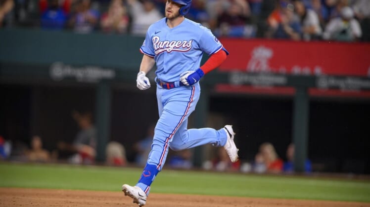 Jun 5, 2022; Arlington, Texas, USA; Texas Rangers designated hitter Mitch Garver (18) rounds the bases after he hits a two run home run against the Seattle Mariners during the eighth inning at Globe Life Field. Mandatory Credit: Jerome Miron-USA TODAY Sports