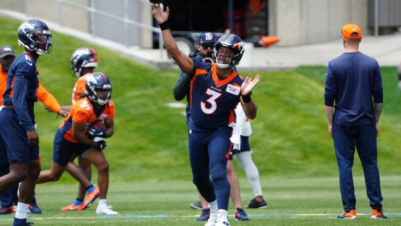 Jun 6, 2022; Englewood, Colorado, USA; Denver Broncos quarterback Russell Wilson (3) passes the ball during OTA workouts at the UC Health Training Center. Mandatory Credit: Ron Chenoy-USA TODAY Sports