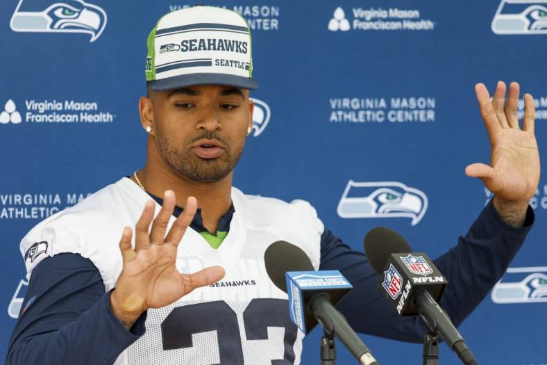 Jun 7, 2022; Renton, Washington, USA; Seattle Seahawks strong safety Jamal Adams (33) talks about past finger injuries during a press conference following a minicamp practice at the Virginia Mason Athletic Center Field. Mandatory Credit: Joe Nicholson-USA TODAY Sports