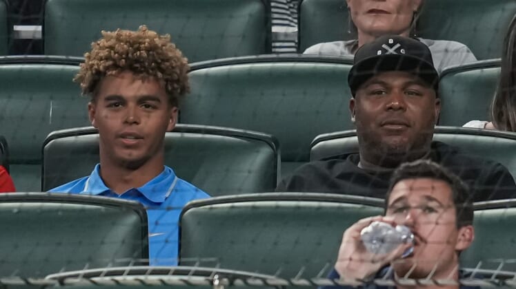 Jun 7, 2022; Cumberland, Georgia, USA; Former Atlanta Braves player Andruw Jones (right) and his son Druw watch the game between the Braves and the Oakland Athletics during the sixth inning at Truist Park. Mandatory Credit: Dale Zanine-USA TODAY Sports