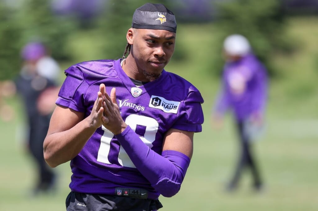 Jun 8, 2022; Minneapolis, Minnesota, USA; Minnesota Vikings wide receiver Justin Jefferson (18) looks on during mandatory mini camp at TCO Performance Center. Mandatory Credit: Matt Krohn-USA TODAY Sports