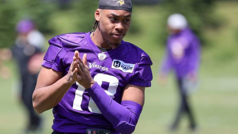 Jun 8, 2022; Minneapolis, Minnesota, USA; Minnesota Vikings wide receiver Justin Jefferson (18) looks on during mandatory mini camp at TCO Performance Center. Mandatory Credit: Matt Krohn-USA TODAY Sports