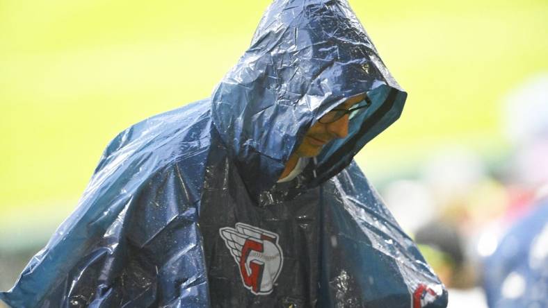 Jun 8, 2022; Cleveland, Ohio, USA; A fan wearing a rain poncho walks to the concourse during a rain delay of a game between the Cleveland Guardians and the Texas Rangers at Progressive Field. Mandatory Credit: David Richard-USA TODAY Sports