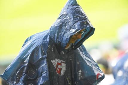 Jun 8, 2022; Cleveland, Ohio, USA; A fan wearing a rain poncho walks to the concourse during a rain delay of a game between the Cleveland Guardians and the Texas Rangers at Progressive Field. Mandatory Credit: David Richard-USA TODAY Sports