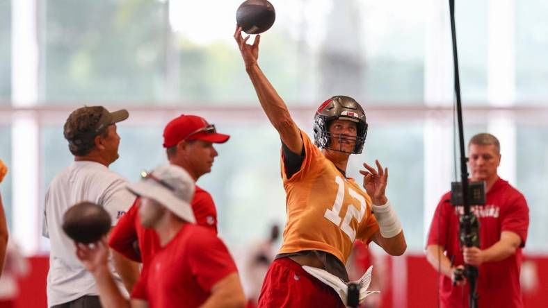 Jun 9, 2022; Tampa, FL, USA;  Tampa Bay Buccaneers quarterback Tom Brady (12) participates in mandatory mini camp at AdventHealth Training Center Mandatory Credit: Nathan Ray Seebeck-USA TODAY Sports