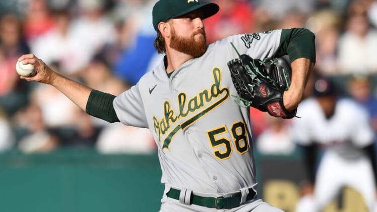 Jun 10, 2022; Cleveland, Ohio, USA; Oakland Athletics starting pitcher Paul Blackburn (58) throws a pitch during the first inning against the Cleveland Guardians at Progressive Field. Mandatory Credit: Ken Blaze-USA TODAY Sports