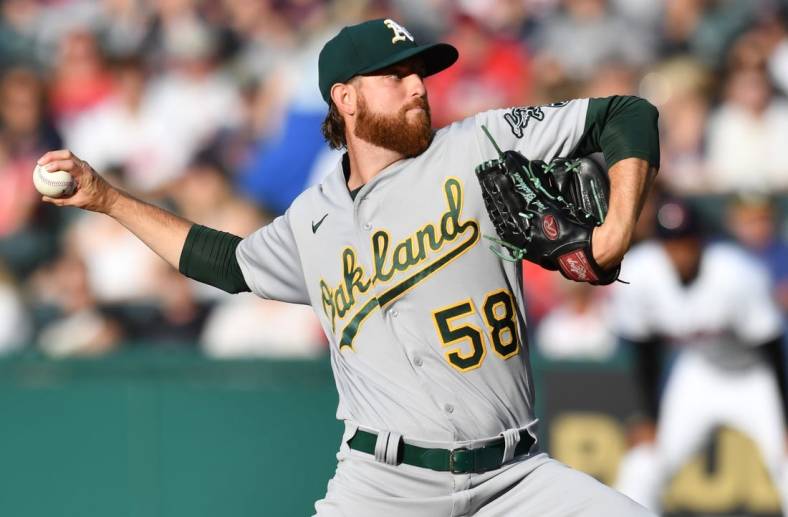 Jun 10, 2022; Cleveland, Ohio, USA; Oakland Athletics starting pitcher Paul Blackburn (58) throws a pitch during the first inning against the Cleveland Guardians at Progressive Field. Mandatory Credit: Ken Blaze-USA TODAY Sports