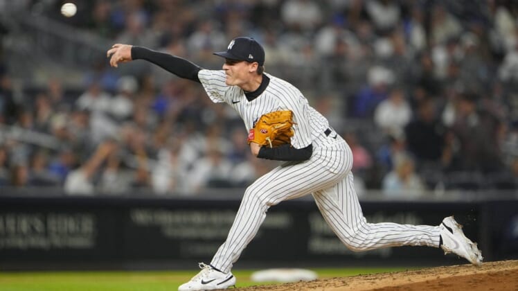 Jun 11, 2022; Bronx, New York, USA; New York Yankees pitcher Ron Marinaccio (97) delivers a pitch against the Chicago Cubs during the eighth inning at Yankee Stadium. Mandatory Credit: Gregory Fisher-USA TODAY Sports
