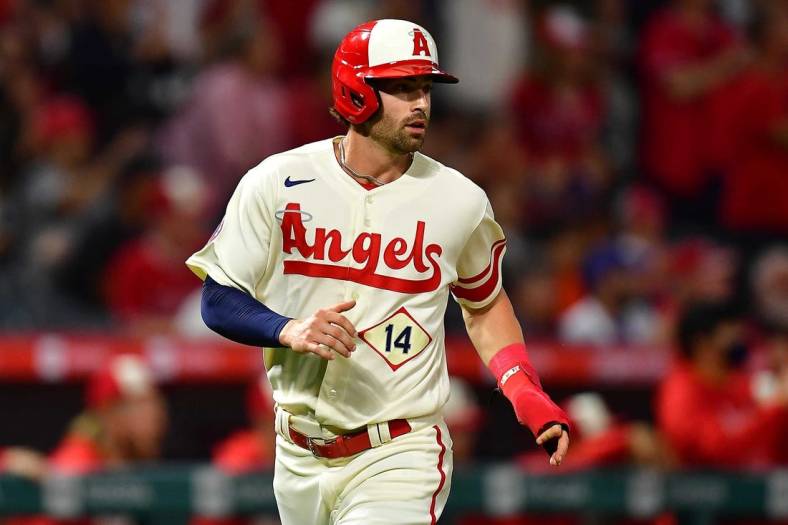 Jun 11, 2022; Anaheim, California, USA; Los Angeles Angels shortstop Tyler Wade (14) scores a run against the New York Mets during the eighth inning at Angel Stadium. Mandatory Credit: Gary A. Vasquez-USA TODAY Sports