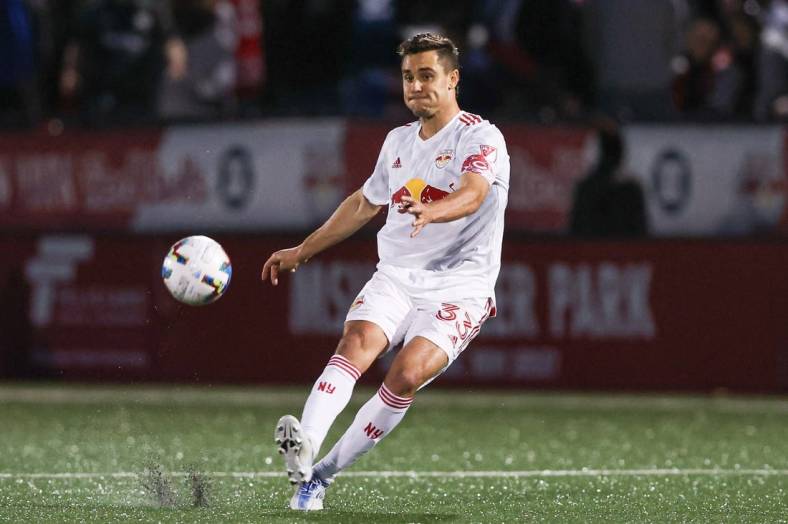 May 25, 2022; Montclair, New Jersey, USA; New York Red Bulls midfielder Aaron Long (33) kicks the ball against Charlotte FC  during the first half at Montclair State University Soccer Park. Mandatory Credit: Vincent Carchietta-USA TODAY Sports