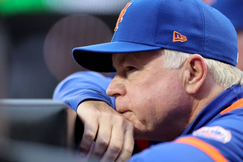 Jun 16, 2022; New York City, New York, USA; New York Mets manager Buck Showalter (11) watches from the dugout during the first inning against the Milwaukee Brewers at Citi Field. Mandatory Credit: Brad Penner-USA TODAY Sports