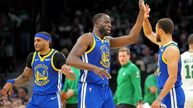 Jun 16, 2022; Boston, Massachusetts, USA; Golden State Warriors forward Draymond Green (23) reacts with guard Stephen Curry (30) during the second quarter against the Boston Celtics in game six of the 2022 NBA Finals at TD Garden. Mandatory Credit: Kyle Terada-USA TODAY Sports