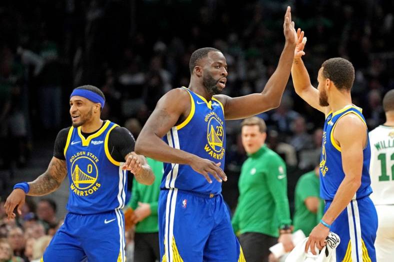 Jun 16, 2022; Boston, Massachusetts, USA; Golden State Warriors forward Draymond Green (23) reacts with guard Stephen Curry (30) during the second quarter against the Boston Celtics in game six of the 2022 NBA Finals at TD Garden. Mandatory Credit: Kyle Terada-USA TODAY Sports