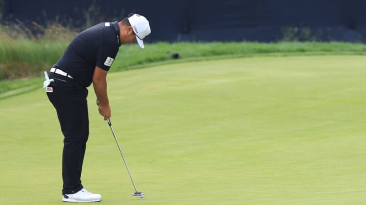 Jun 17, 2022; Brookline, Massachusetts, USA; Sungjae Im putts on the 17th green during the second round of the U.S. Open golf tournament. Mandatory Credit: Aaron Doster-USA TODAY Sports