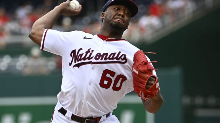 Jun 17, 2022; Washington, District of Columbia, USA; Washington Nationals pitcher Joan Adon (60) throws to the Philadelphia Phillies during the first inning at Nationals Park. Mandatory Credit: Brad Mills-USA TODAY Sports