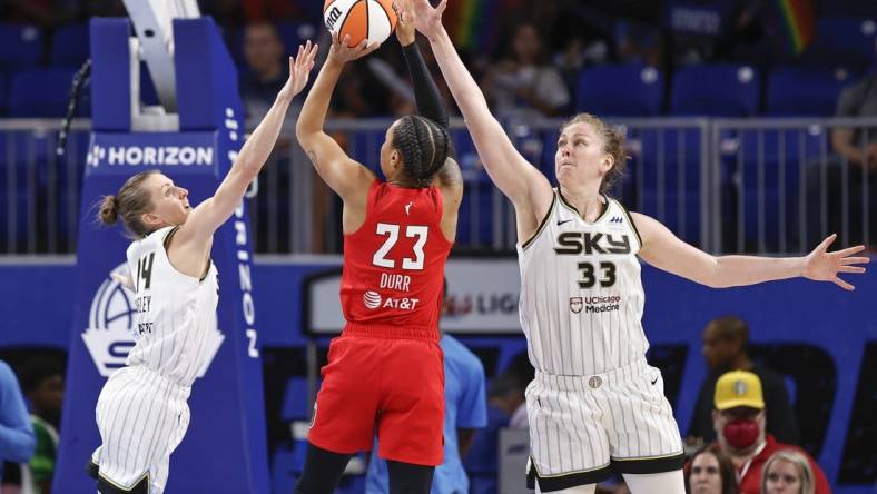 Jun 17, 2022; Chicago, Illinois, USA; Atlanta Dream guard Asia Durr (23) shoots against Chicago Sky guard Allie Quigley (14) and forward Emma Meesseman (33) during the second half of a WNBA game at Wintrust Arena. Mandatory Credit: Kamil Krzaczynski-USA TODAY Sports