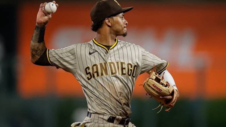 Jun 17, 2022; Denver, Colorado, USA; San Diego Padres third baseman Sergio Alcantara (41) makes a throw to first for an out in the seventh inning against the Colorado Rockies at Coors Field. Mandatory Credit: Isaiah J. Downing-USA TODAY Sports