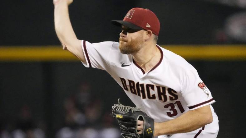 Jun 13, 2022; Phoenix, Arizona, U.S.; Arizona Diamondbacks relief pitcher Ian Kennedy (31) throws against the Cincinnati Reds during the ninth inning at Chase Field.

Mlb Reds At Diamondbacks Cincinnati Reds At Arizona Diamondbacks