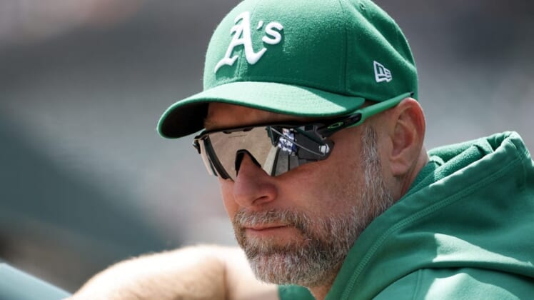 May 12, 2022; Detroit, Michigan, USA; Oakland Athletics manager Mark Kotsay (7) watches from the dugout in the first inning against the Detroit Tigers at Comerica Park. Mandatory Credit: Rick Osentoski-USA TODAY Sports