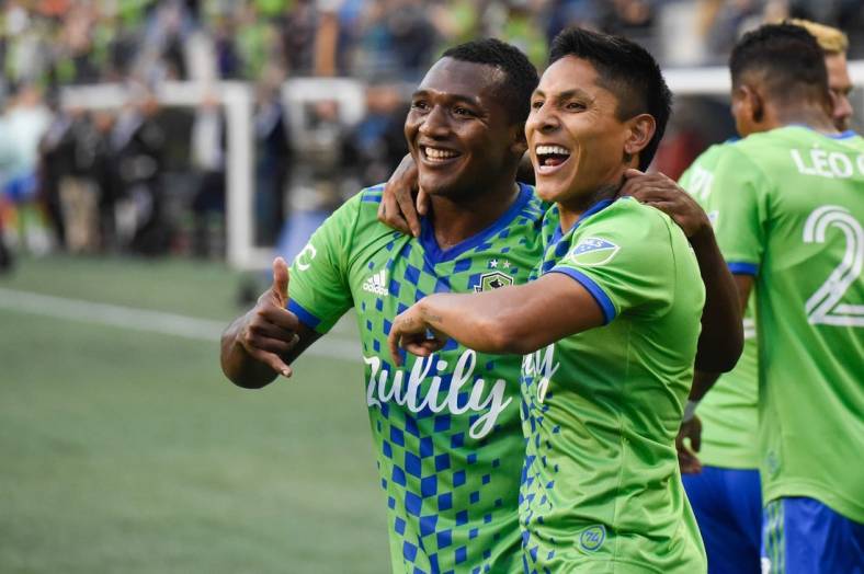 Jun 14, 2022; Seattle, Washington, USA; Seattle Sounders forward Raul Ruidiaz (right) celebrates his goal against the Vancouver Whitecaps with midfielder Jimmy Medranda (94) during the first half at Lumen Field. Mandatory Credit: Michael Thomas Shroyer-USA TODAY Sports
