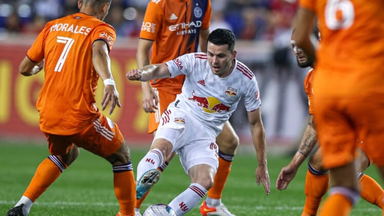 Jun 22, 2022; Harrison, NJ, United States; New York Red Bulls midfielder Lewis Morgan (10) plays the ball asNew York City FC midfielder Alfredo Morales (7) defends during the first half at Red Bull Arena. Mandatory Credit: Vincent Carchietta-USA TODAY Sports