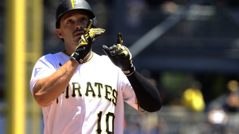 Jun 23, 2022; Pittsburgh, Pennsylvania, USA;  Pittsburgh Pirates center fielder Bryan Reynolds (10) reacts crossing home plate on a solo home run against the Chicago Cubs during the first inning at PNC Park. Mandatory Credit: Charles LeClaire-USA TODAY Sports