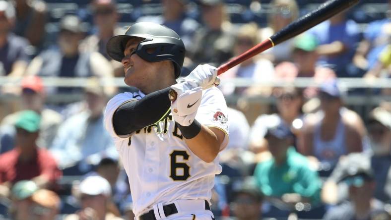 Jun 23, 2022; Pittsburgh, Pennsylvania, USA;  Pittsburgh Pirates designated hitter Yu Chang (6) hits a single against the Chicago Cubs during the sixth inning at PNC Park. Mandatory Credit: Charles LeClaire-USA TODAY Sports