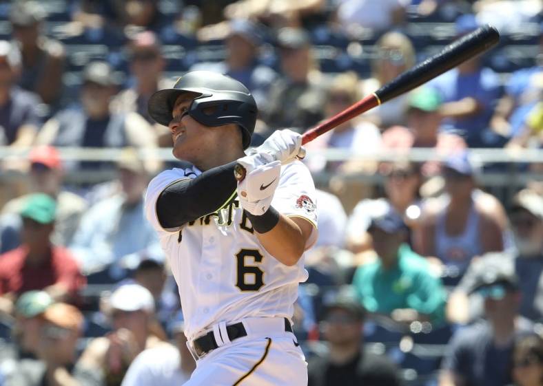 Jun 23, 2022; Pittsburgh, Pennsylvania, USA;  Pittsburgh Pirates designated hitter Yu Chang (6) hits a single against the Chicago Cubs during the sixth inning at PNC Park. Mandatory Credit: Charles LeClaire-USA TODAY Sports