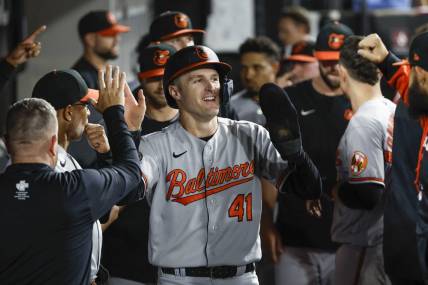 Jun 23, 2022; Chicago, Illinois, USA; Baltimore Orioles third baseman Tyler Nevin (41) celebrates after scoring against the Chicago White Sox during the ninth inning at Guaranteed Rate Field. Mandatory Credit: Kamil Krzaczynski-USA TODAY Sports