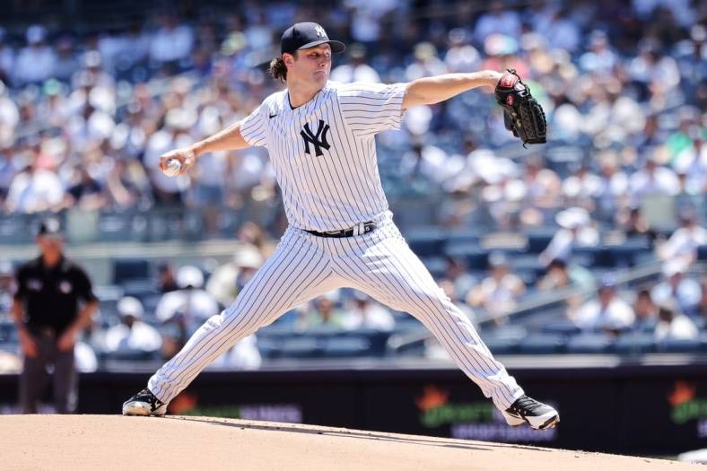 Jun 25, 2022; Bronx, New York, USA; New York Yankees starting pitcher Gerrit Cole throws a pitch during the first inning against the Houston Astros at Yankee Stadium. Mandatory Credit: Jessica Alcheh-USA TODAY Sports