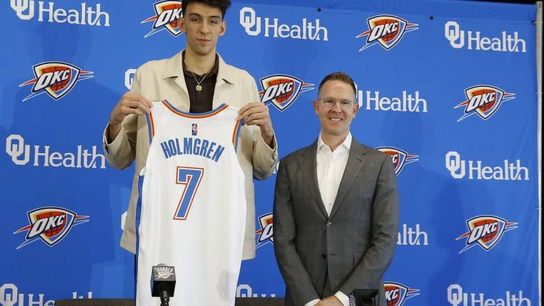 Jun 25, 2022; Oklahoma City, OK, USA; Oklahoma City Thunder forward Chet Holmgren poses with his jersey and general manager Sam Presti following an introductory press conference at Clara Luper Center. Mandatory Credit: Alonzo Adams-USA TODAY Sports