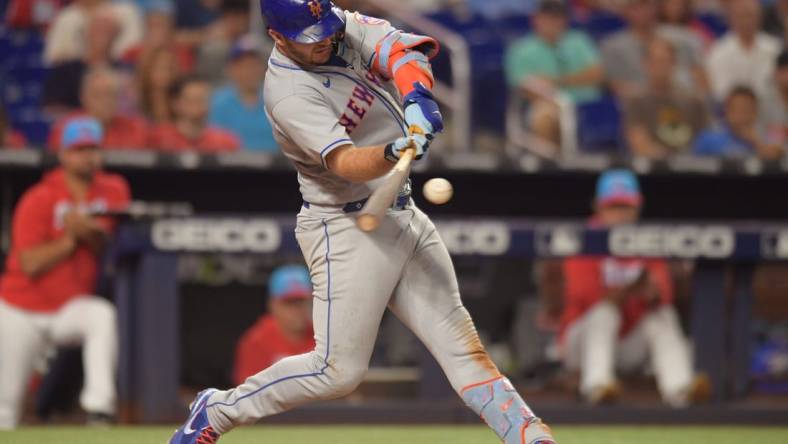 Jun 25, 2022; Miami, Florida, USA; New York Mets first baseman Pete Alonso (20) hits a home run in the eighth inning against the Miami Marlins at loanDepot Park. Mandatory Credit: Jim Rassol-USA TODAY Sports