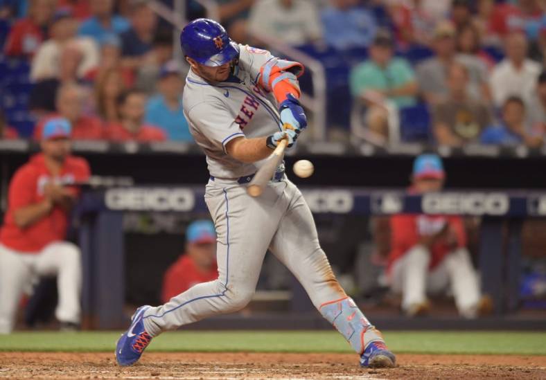 Jun 25, 2022; Miami, Florida, USA; New York Mets first baseman Pete Alonso (20) hits a home run in the eighth inning against the Miami Marlins at loanDepot Park. Mandatory Credit: Jim Rassol-USA TODAY Sports