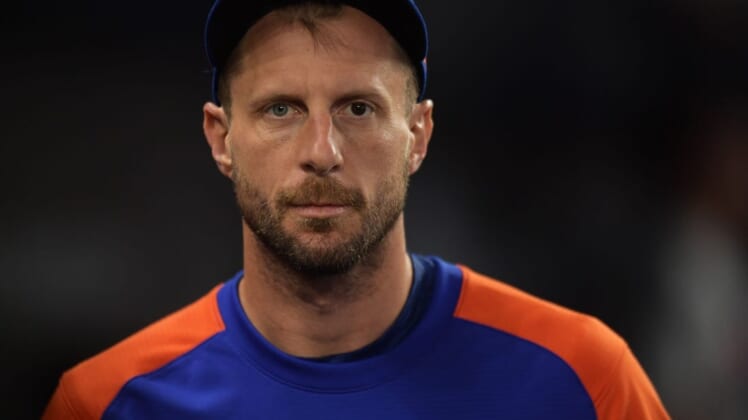 Jun 25, 2022; Miami, Florida, USA; New York Mets pitcher Max Scherzer walks along the dugout during the game against the Miami Marlins at loanDepot Park. Mandatory Credit: Jim Rassol-USA TODAY Sports