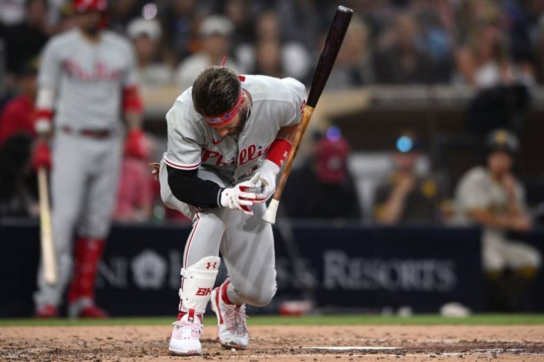 Jun 25, 2022; San Diego, California, USA; Philadelphia Phillies designated hitter Bryce Harper (3) reacts after being hit by a pitch during the fourth inning against the San Diego Padres at Petco Park. Mandatory Credit: Orlando Ramirez-USA TODAY Sports
