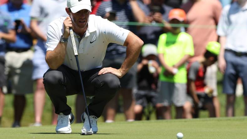 Jun 26, 2022; Cromwell, Connecticut, USA; Rory McIlroy looks over a putt on the fourth green during the final round of the Travelers Championship golf tournament. Mandatory Credit: Vincent Carchietta-USA TODAY Sports